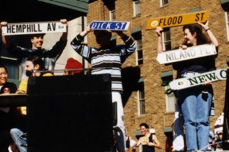 Students with street name signs